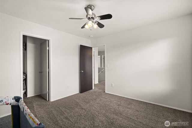 unfurnished bedroom featuring baseboards, carpet, and ceiling fan