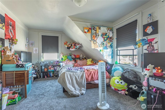 bedroom featuring carpet and vaulted ceiling