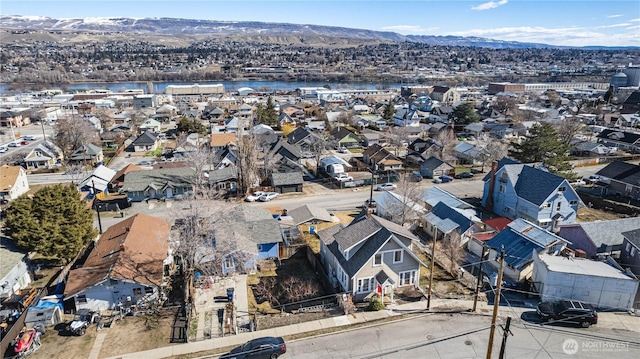 bird's eye view with a water and mountain view and a residential view