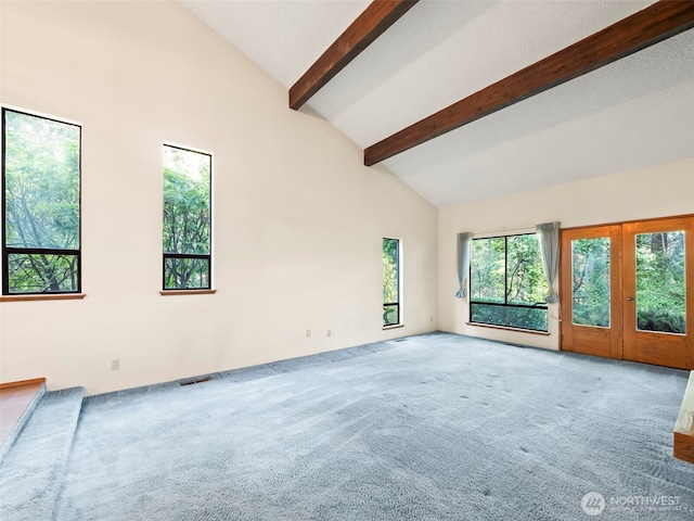 carpeted empty room featuring visible vents, high vaulted ceiling, and beamed ceiling