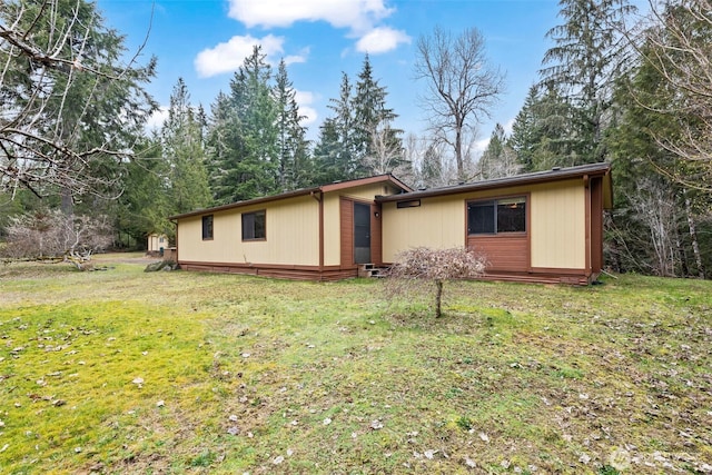 ranch-style home with a front lawn