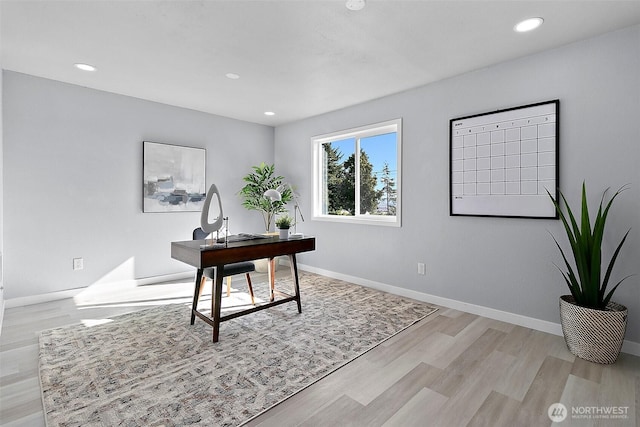 office space featuring recessed lighting, light wood-style flooring, and baseboards