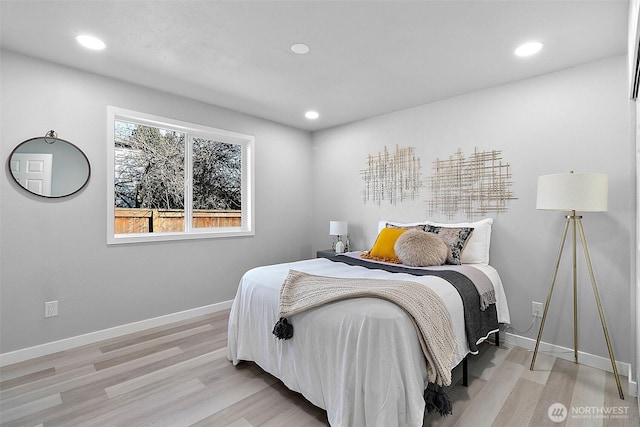 bedroom featuring recessed lighting, baseboards, and wood finished floors