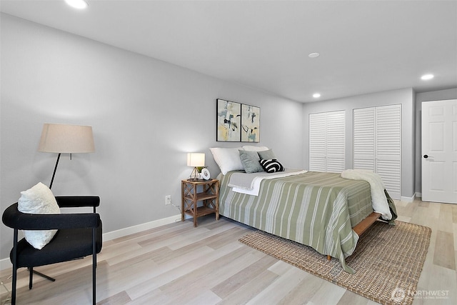 bedroom with light wood finished floors, baseboards, and recessed lighting