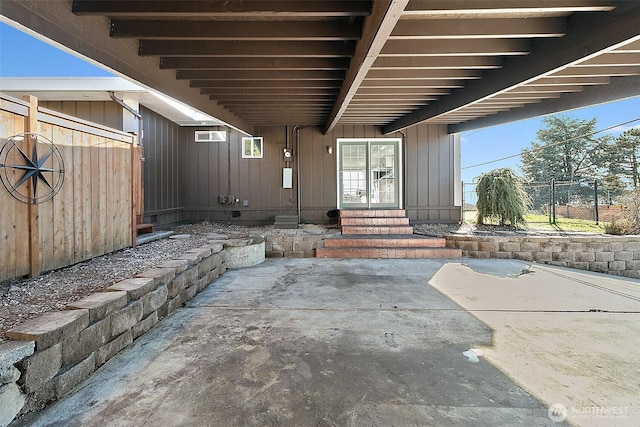 view of patio / terrace featuring entry steps and fence