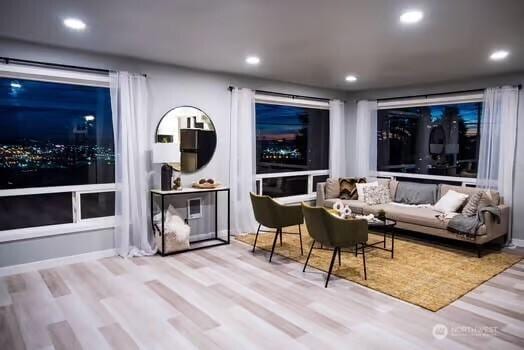 interior space with wood finished floors and recessed lighting