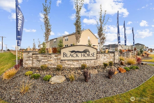 community / neighborhood sign featuring a residential view