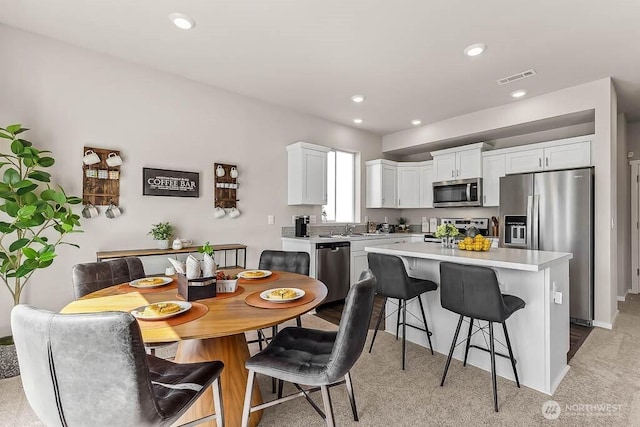 dining room featuring recessed lighting and visible vents