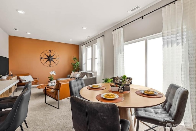 dining area featuring recessed lighting, visible vents, and light colored carpet