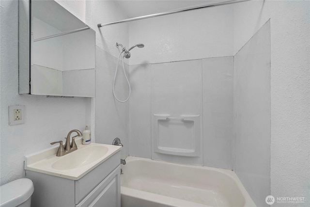 full bath with shower / bathing tub combination, vanity, and toilet