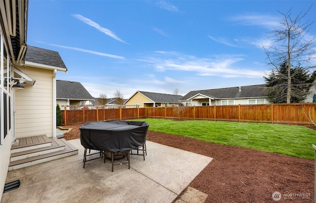 view of patio with a residential view and a fenced backyard