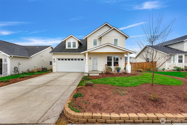 traditional home with fence, a front lawn, concrete driveway, and roof with shingles