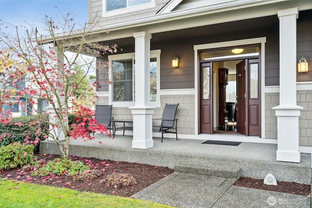 entrance to property featuring a porch