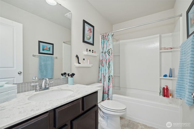 bathroom with vanity, shower / bath combination with curtain, and toilet