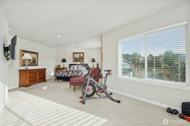 exercise area featuring carpet, baseboards, and recessed lighting