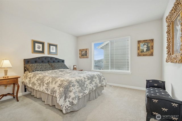 carpeted bedroom featuring baseboards