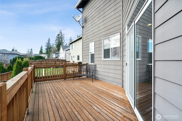 wooden terrace featuring a residential view