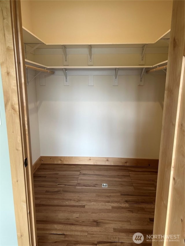 spacious closet with wood finished floors