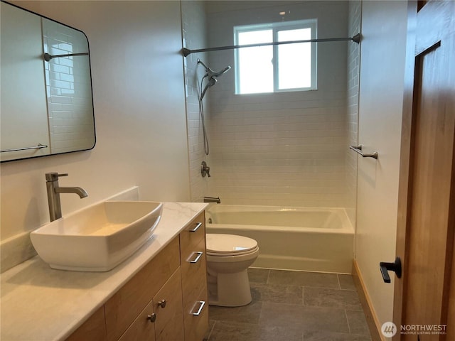 bathroom featuring toilet, shower / bathtub combination, baseboards, and vanity