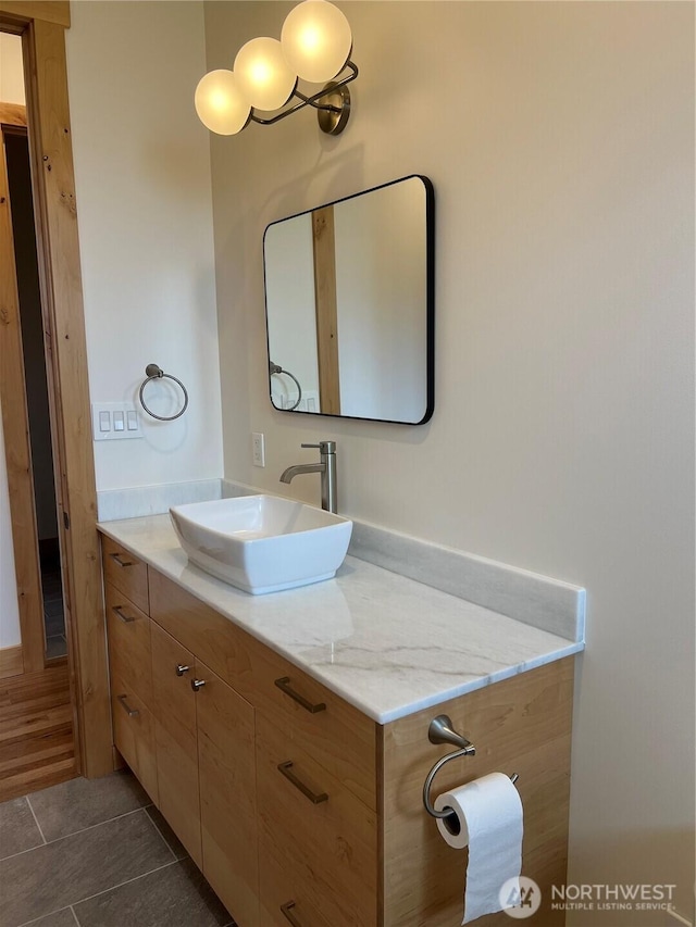 bathroom featuring tile patterned flooring and vanity