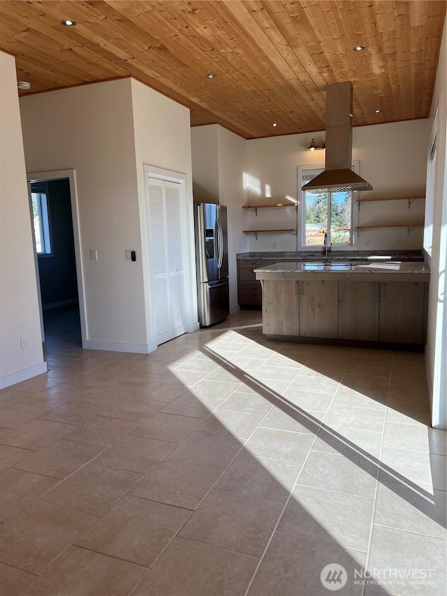 kitchen featuring island exhaust hood, open shelves, stainless steel fridge, and wood ceiling