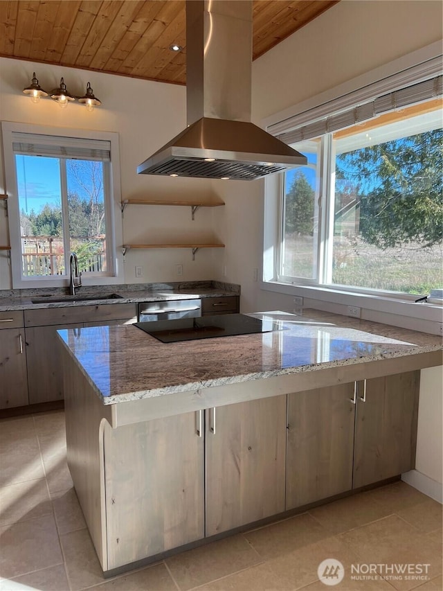 kitchen with light tile patterned floors, island range hood, wooden ceiling, a healthy amount of sunlight, and a sink