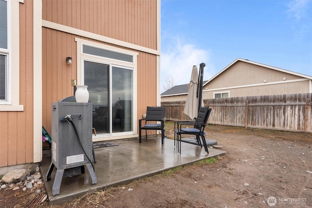 view of patio featuring fence