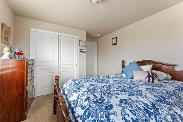 carpeted bedroom featuring a closet