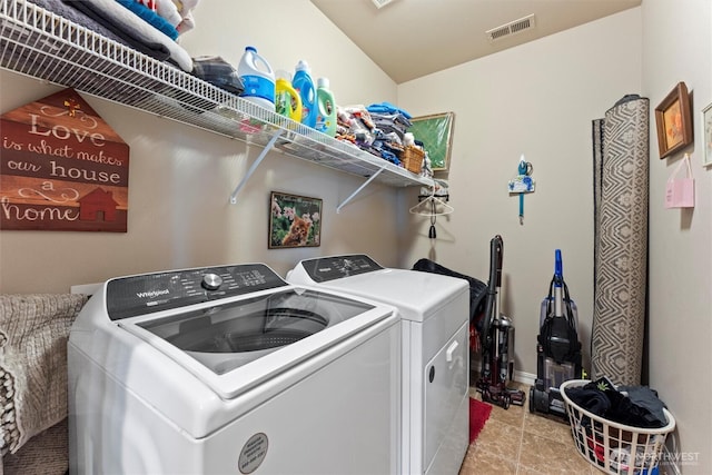 laundry room with light tile patterned floors, laundry area, visible vents, and separate washer and dryer