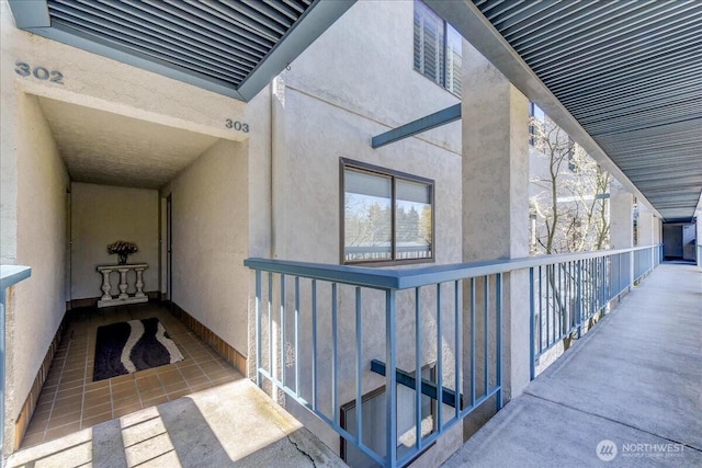 view of exterior entry featuring stucco siding