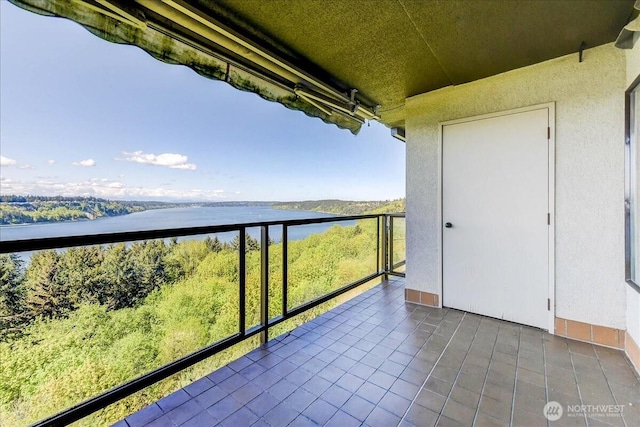 balcony featuring a water view