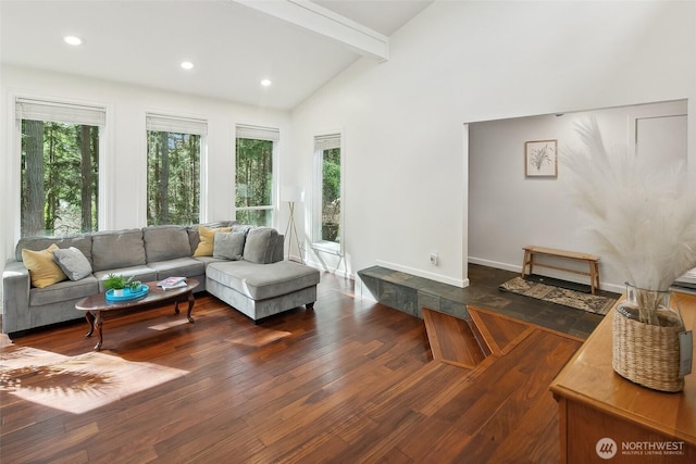 living area with vaulted ceiling with beams, hardwood / wood-style flooring, baseboards, and recessed lighting