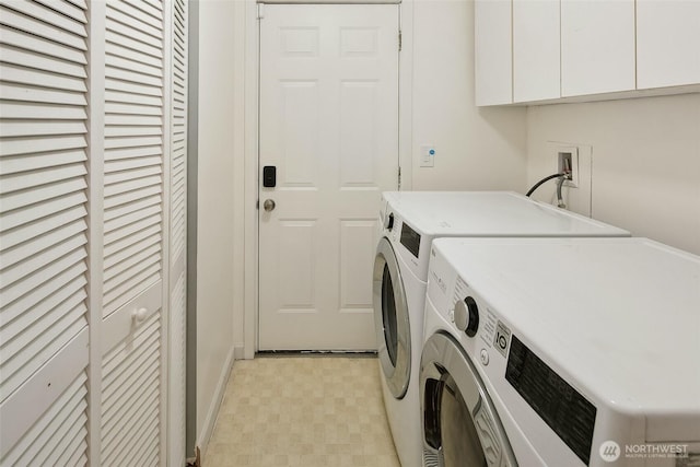 clothes washing area featuring light floors, independent washer and dryer, and cabinet space