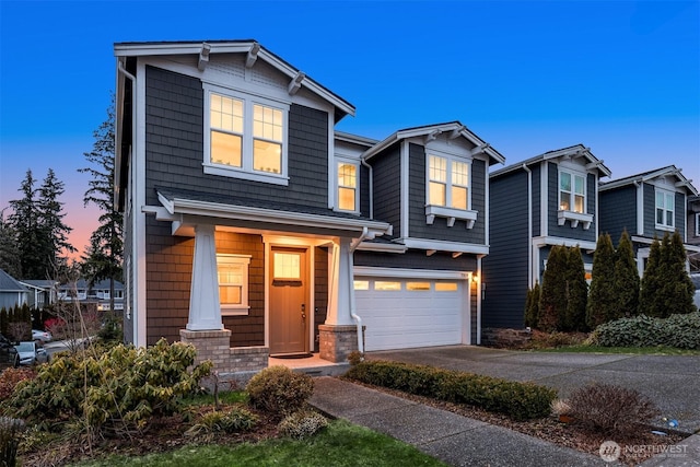 craftsman-style house featuring driveway and a garage