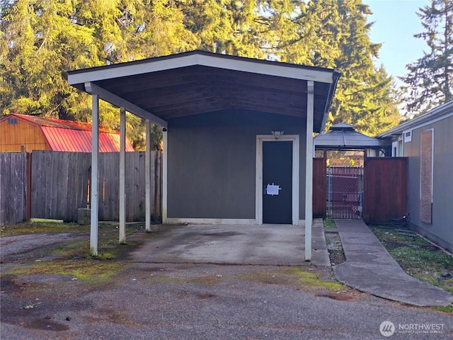 view of outdoor structure with a gate and fence