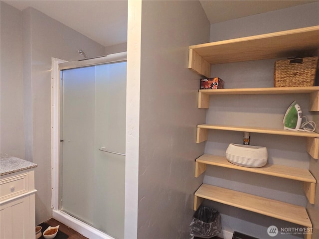 bathroom with a shower stall