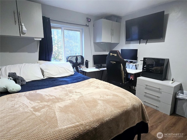 bedroom featuring wood finished floors