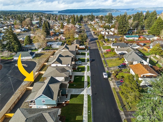 aerial view with a water view and a residential view