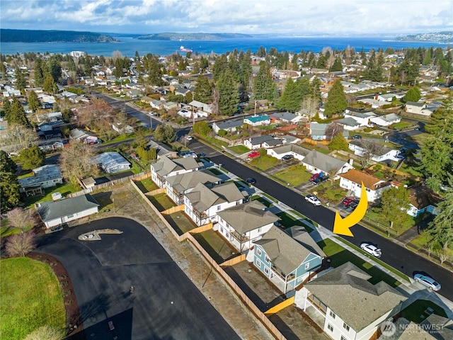 bird's eye view featuring a water view and a residential view