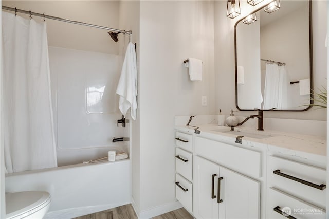 full bathroom with shower / bath combo, vanity, toilet, and wood finished floors