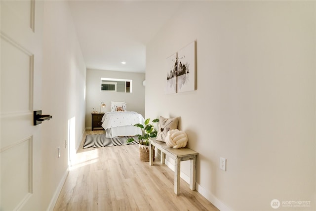 interior space with light wood finished floors and baseboards