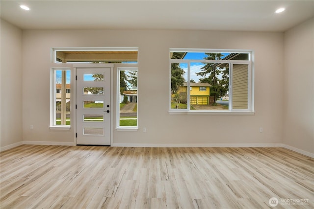 entryway featuring recessed lighting, baseboards, and wood finished floors