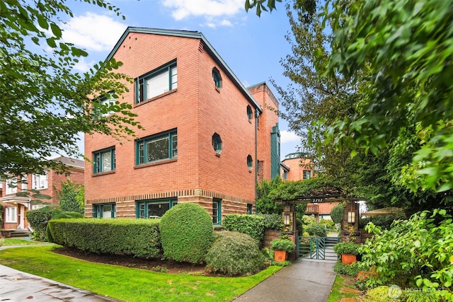 view of home's exterior with brick siding