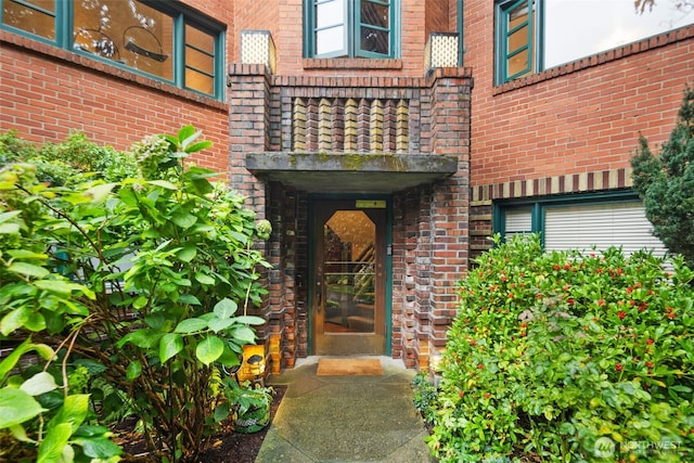 property entrance with brick siding