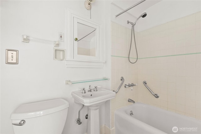 full bathroom featuring shower / bathing tub combination, a sink, and toilet