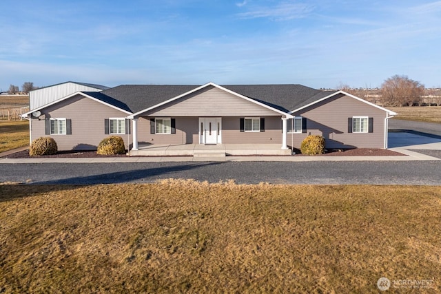 ranch-style house with a front lawn