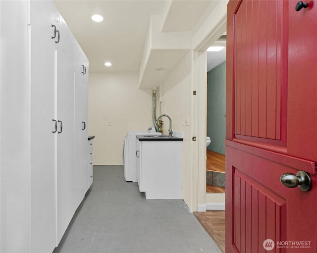 washroom featuring recessed lighting and a sink