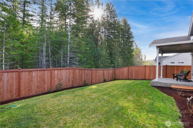 view of yard with a fenced backyard