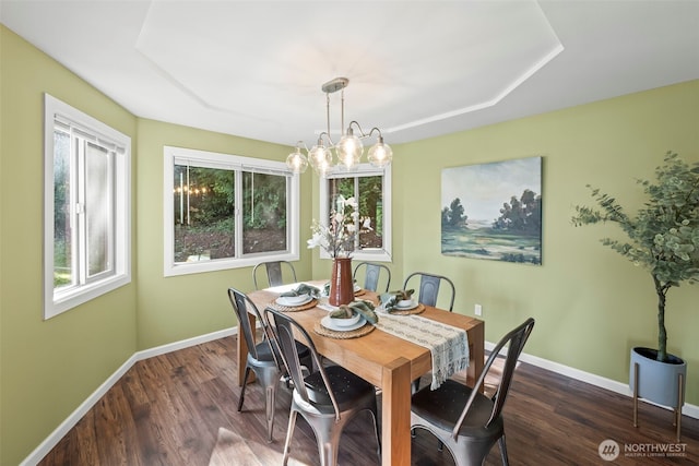 dining room with dark wood-style flooring and baseboards