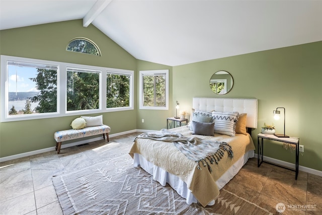 bedroom featuring vaulted ceiling with beams and baseboards